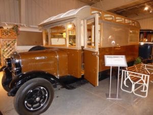 Vintage mobile homes that are brown with wheels