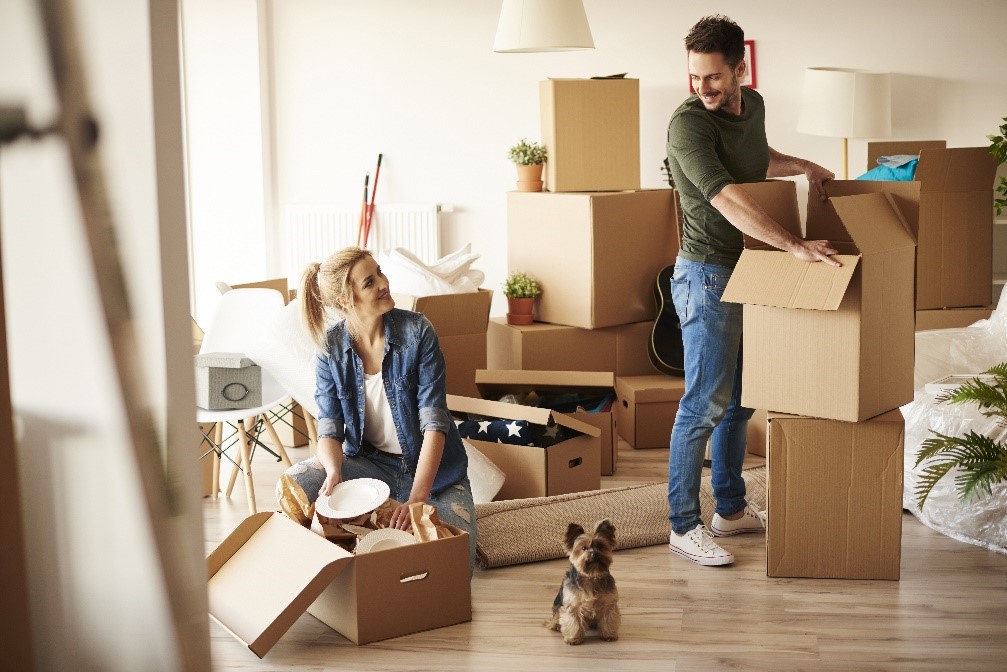 A family packing up boxes