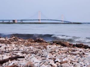 The mackinaw bridge in background rocks in the front