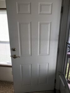 A white steel door that is open