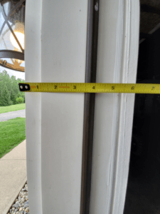 A tape measure showing how to measure a mobile home door