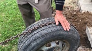 A tire used to pull up mobile home anchors