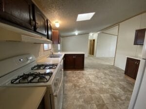 A mobile home kitchen with natural light