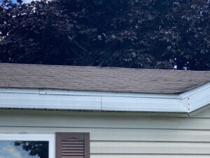 A shingled roof with missing shingles