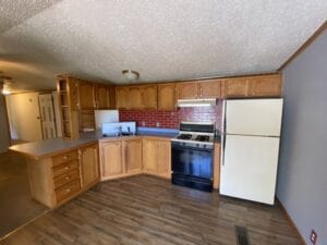 A mobile home kitchen with red walls