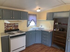 A country blue kitchen cabinet