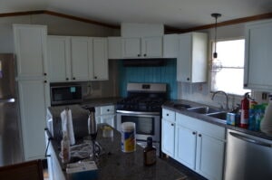 An before shot of a mobile home remodel in the kitchen