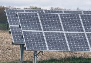 A solar panel sitting in a field