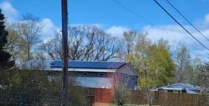 A solar panel on top of a polebarn