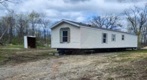 A singlewide mobile home on property ready to move