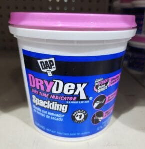 A small bucket of Dry Dex drywall mud