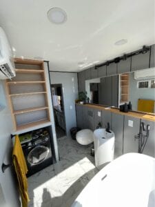 A gray kitchen inside a container home