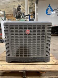 A large ac condenser sitting on a pallet