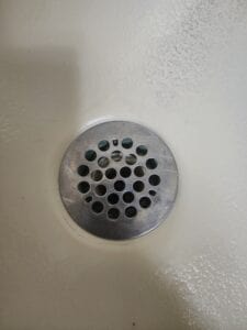 A drain in the bottom of a sink