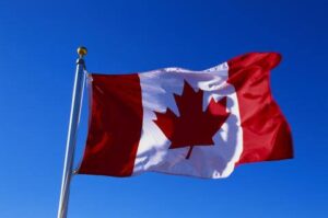 a Canadian flag waving in the wind
