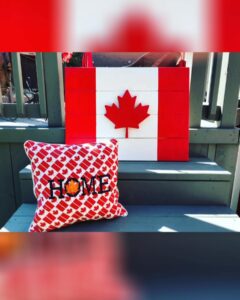 A canadian symbol with a pillow near it