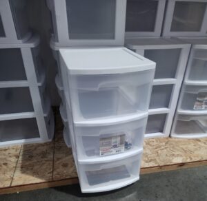 A white storage case with drawers