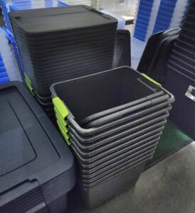A bunch of large plastic totes