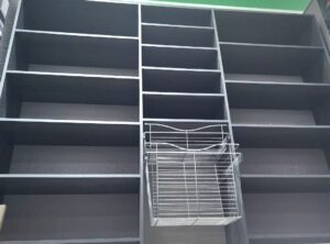 A wooden shelf storage unit for a closet