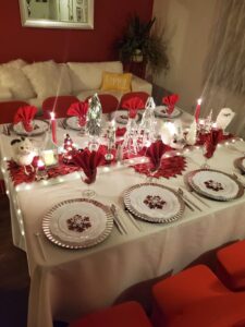 A table set with Christmas decorations and plates