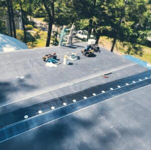 A rubber roof being installed on a home