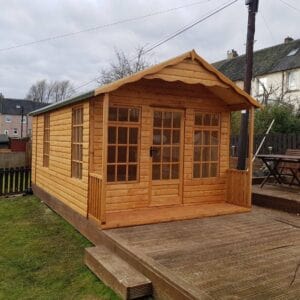 A cedar sided mobile home shed with glass doors