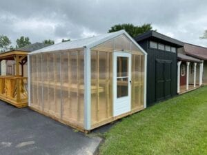 A greenhouse type shed with clear sides