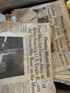 A bunch of newspapers scattered on the floor