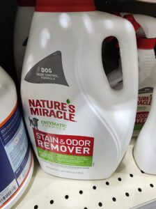 A bottle of Natures Miracle used to remove pet stains from carpet
