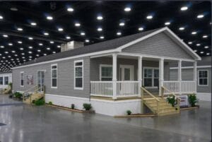 A doublewide mobile home set up inside a show room
