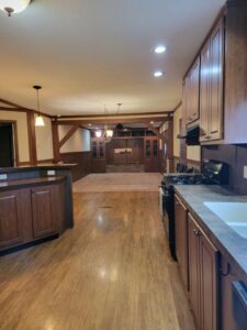A beautiful kitchen with canned lighting and wood floors