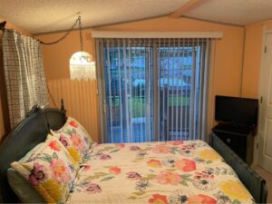 A yellow small bedroom in a mobile home