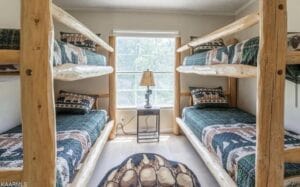 A set of bunk beds built into the walls of a room