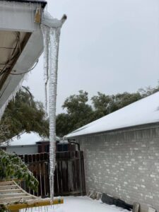 ice hanging from a soffit overhang