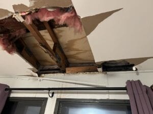 A ceiling that is falling in due to water damage