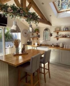 A white kitchen with beautiful wood decor
