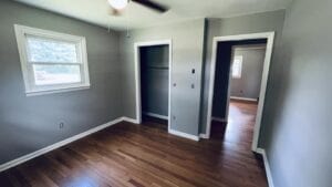 A newly painted bedroom with new wood floors