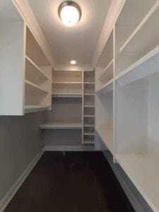 A large empty white closet space