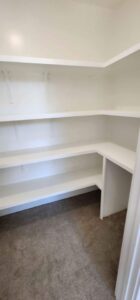 A white shelf unit used to organize