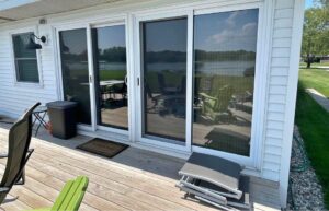 Two sliding glass doors on a deck