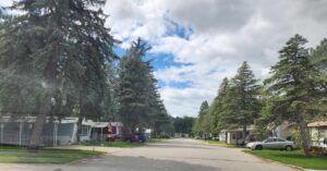 A view of a mobile home park with singlewides and doublewides