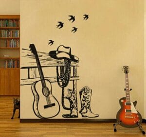A western style wall sticker with boots and guitar