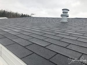 A 3 in 1 shingle roof with a stove pipe