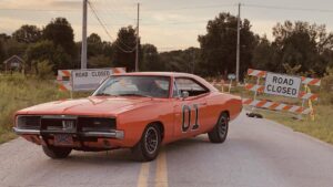 The General Lee car sitting on a paved road