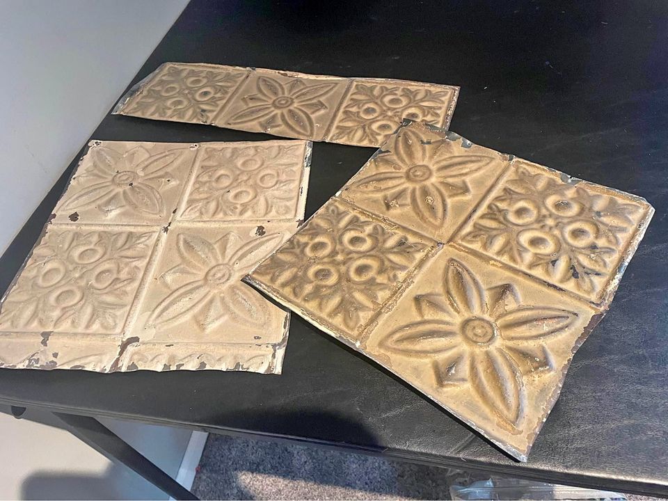 A set of brown metal ceiling tiles in star patterns