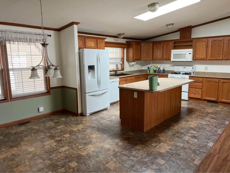 A large kitchen in a mobile home doublewide