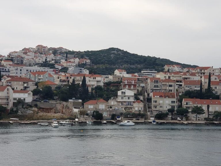 A picture of Croatia showing homes from the water