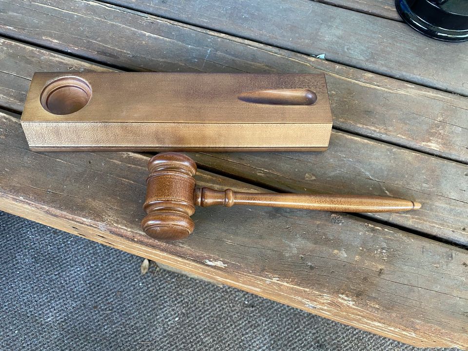 a judges hammer sitting on a bench