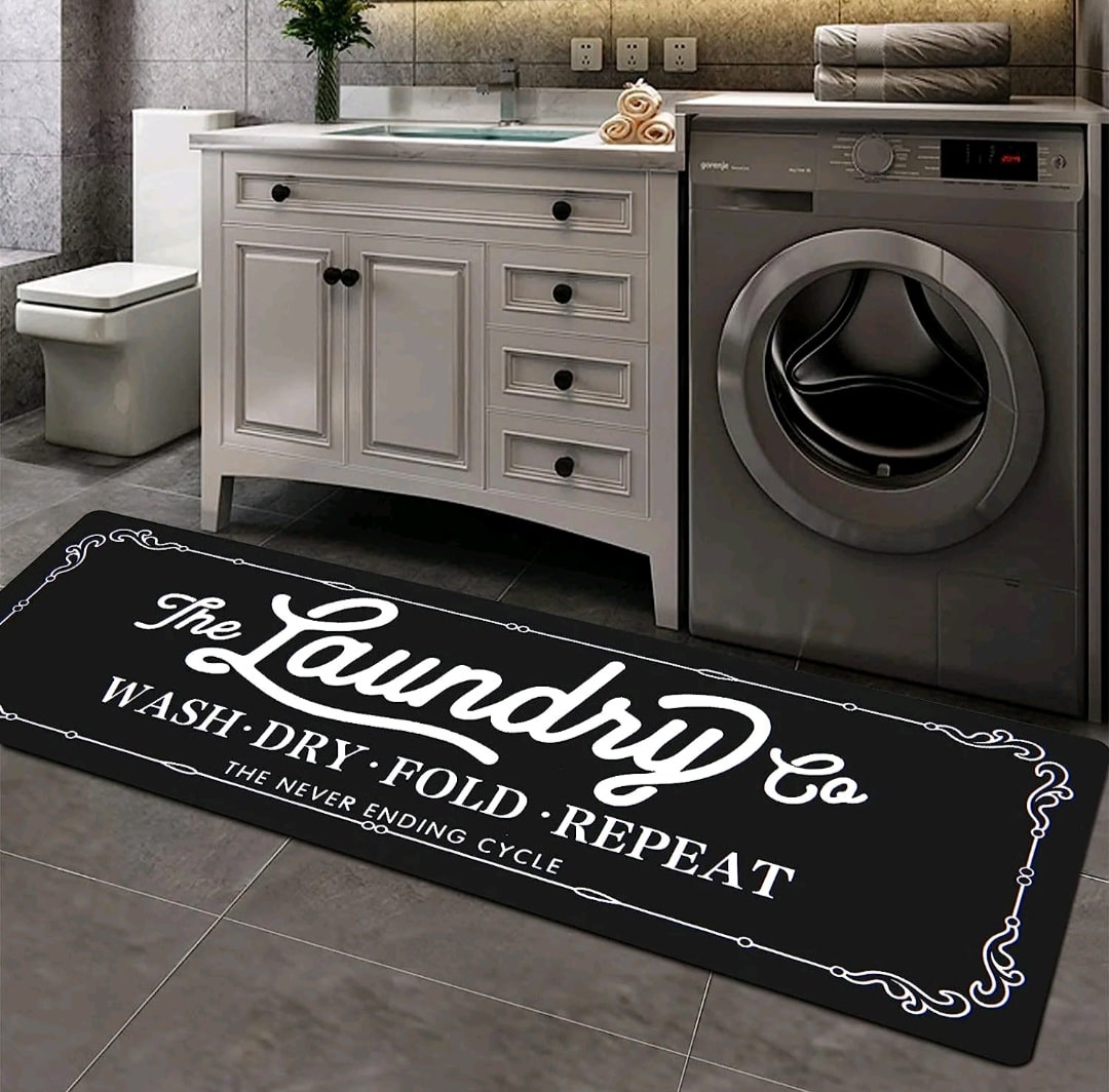 A black laundry room rug with Laundry written on it