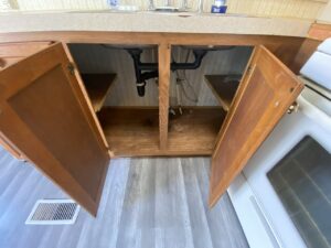 A view under a mobile home kitchen sink